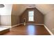 Spacious bedroom with window, wood floors, and neutral paint colors, a perfect retreat for relaxation at 225 Austin Oaks Se Dr, Ellenwood, GA 30294