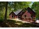 Charming brick home with landscaped front yard and manicured lawn; inviting curb appeal at 225 Austin Oaks Se Dr, Ellenwood, GA 30294