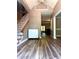 Inviting foyer with wood floors and staircase; offering a glimpse into the home's interior at 225 Austin Oaks Se Dr, Ellenwood, GA 30294