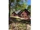 Charming brick home featuring manicured landscaping and a well-maintained front yard at 225 Austin Oaks Se Dr, Ellenwood, GA 30294