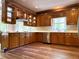 Well-lit kitchen with custom wood cabinetry, white countertops, and modern stainless steel appliances at 225 Austin Oaks Se Dr, Ellenwood, GA 30294