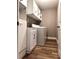 Organized laundry room with ample storage space, shelving, and modern washer/dryer at 225 Austin Oaks Se Dr, Ellenwood, GA 30294
