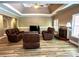 Spacious living room boasting coffered ceilings, hardwood floors, and a cozy fireplace at 225 Austin Oaks Se Dr, Ellenwood, GA 30294