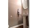 Chic powder room featuring a stylish pedestal sink and modern fixtures at 225 Austin Oaks Se Dr, Ellenwood, GA 30294