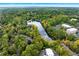 Scenic aerial view of a tree-lined community with lake, office park, and residential apartments at 2404 Northlake Ct, Atlanta, GA 30345