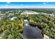 Picturesque aerial shot of lush green space, with a serene lake, trees and nearby buildings at 2404 Northlake Ct, Atlanta, GA 30345