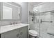 Updated bathroom with glass shower, elegant vanity, and modern fixtures at 2404 Northlake Ct, Atlanta, GA 30345