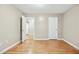 An empty bedroom space has light wood flooring and fresh paint, ready for customization at 2404 Northlake Ct, Atlanta, GA 30345