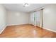 Spacious bedroom featuring gleaming hardwood floors, neutral paint, and natural light at 2404 Northlake Ct, Atlanta, GA 30345