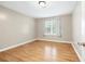 Inviting bedroom featuring light-colored wood floors and a bright window at 2404 Northlake Ct, Atlanta, GA 30345