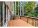 A spacious wooden deck offers relaxing outdoor area with views of the trees and surrounding landscape at 2404 Northlake Ct, Atlanta, GA 30345