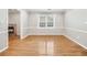 Spacious dining room with hardwood floors, bright natural light, and neutral-colored walls at 2404 Northlake Ct, Atlanta, GA 30345