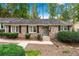 Charming brick home featuring a well-manicured lawn and inviting front entrance at 2404 Northlake Ct, Atlanta, GA 30345