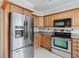 Kitchen featuring stainless steel appliances and wood cabinetry at 2404 Northlake Ct, Atlanta, GA 30345
