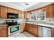 Cozy kitchen with stainless steel appliances and wooden cabinets at 2404 Northlake Ct, Atlanta, GA 30345