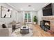 Cozy living room featuring hardwood floors, a fireplace, and a door to the outside at 2404 Northlake Ct, Atlanta, GA 30345