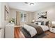Beautifully staged bedroom with laminate wood floors, neutral walls, and stylish decor at 2404 Northlake Ct, Atlanta, GA 30345