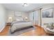 Elegantly furnished bedroom with hardwood floors, area rug, and decorative art at 2404 Northlake Ct, Atlanta, GA 30345