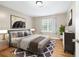 Comfortable main bedroom with a large bed, stylish decor, and lots of natural light at 2404 Northlake Ct, Atlanta, GA 30345