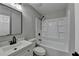 Bathroom features a vanity, mirror, toilet and shower/tub combination at 5825 Rolling Oaks Dr, Cumming, GA 30040