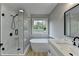 Modern bathroom with soaking tub, glass shower, and stylish vanity at 5825 Rolling Oaks Dr, Cumming, GA 30040