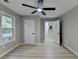 This bedroom offers recessed lighting and neutral paint, leading to a stairway with wood steps at 5825 Rolling Oaks Dr, Cumming, GA 30040