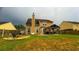 Expansive backyard with a firepit, grill, and pergola, perfect for outdoor entertainment and relaxation at 2144 Beacon Crest Dr, Buford, GA 30519