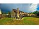 Spacious backyard with a fire pit area and a covered patio, ideal for entertaining at 2144 Beacon Crest Drive, Buford, GA 30519