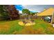 Lush backyard featuring a fire pit surrounded by chairs, perfect for outdoor gatherings at 2144 Beacon Crest Drive, Buford, GA 30519