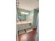 Functional bathroom features double sinks, a large mirror, and well-maintained tile flooring at 2144 Beacon Crest Drive, Buford, GA 30519