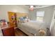 Comfortable bedroom featuring a large bed, soft lighting, and a window offering natural light at 2144 Beacon Crest Drive, Buford, GA 30519