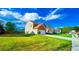 Well-kept suburban home featuring lush landscaping and a long driveway at 2144 Beacon Crest Drive, Buford, GA 30519