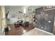 Comfortable living room featuring hardwood floors, high ceilings, and artistic decor at 2144 Beacon Crest Drive, Buford, GA 30519
