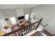 Bright living room viewed from above showcasing hardwood floors, fireplace, and large windows at 2144 Beacon Crest Drive, Buford, GA 30519