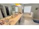 Bright main bathroom featuring double sinks, a soaking tub, a walk-in closet, and a separate shower at 2144 Beacon Crest Drive, Buford, GA 30519
