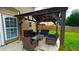 Outdoor patio area with comfortable seating, an overhead roof, and a ceiling fan at 2144 Beacon Crest Drive, Buford, GA 30519
