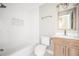 Clean bathroom with a tub, tiled walls, and vanity, providing a functional and comfortable space at 2198 Star Mist Sw Dr, Atlanta, GA 30311