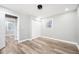This bedroom boasts wood-look floors, a closet, and a window offering plenty of natural light at 2198 Star Mist Sw Dr, Atlanta, GA 30311