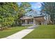 Charming single-story home featuring a brick facade, cozy front porch, and an inviting carport at 2198 Star Mist Sw Dr, Atlanta, GA 30311