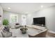Inviting living room with neutral tones, recessed lighting, and modern furnishings for a comfortable space at 2198 Star Mist Sw Dr, Atlanta, GA 30311