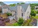 The backyard features a cozy patio, lush greenery, and a convenient storage shed for outdoor essentials at 2325 Walnut Grove Way, Suwanee, GA 30024