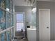 Bathroom featuring decorative glass window, chandelier, and white vanity at 2325 Walnut Grove Way, Suwanee, GA 30024