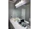 Bathroom with a marble vanity, large mirror, and lighting at 2325 Walnut Grove Way, Suwanee, GA 30024