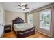 Bedroom with hardwood floors, natural light, a ceiling fan, and a comfortable bed at 2325 Walnut Grove Way, Suwanee, GA 30024