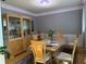 Formal dining room with wainscoting, decorative light fixture, and large hutch at 2325 Walnut Grove Way, Suwanee, GA 30024