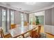 Dining room with hardwood floors, natural light from the windows, and neutral color palette at 2325 Walnut Grove Way, Suwanee, GA 30024