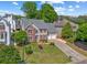 Charming two-story home featuring a well-manicured lawn and a spacious two-car garage at 2325 Walnut Grove Way, Suwanee, GA 30024