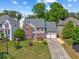 Charming two-story home featuring a well-manicured lawn and a spacious two-car garage at 2325 Walnut Grove Way, Suwanee, GA 30024