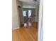 Hallway featuring hardwood floors, stairs, and a view of the second floor at 2325 Walnut Grove Way, Suwanee, GA 30024