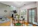 Open floor plan with high ceilings, large windows, ceiling fan and an adjacent kitchen and dining area at 2325 Walnut Grove Way, Suwanee, GA 30024